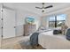 Spacious main bedroom with large window and light hardwood floors at 16247 Hidden Oak Loop, Bradenton, FL 34211