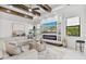 Bright living room boasts a modern fireplace and large sectional sofa at 16247 Hidden Oak Loop, Bradenton, FL 34211