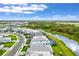 Aerial view of houses, street, and waterway at 16247 Hidden Oak Loop, Bradenton, FL 34211