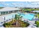 Aerial view of a community pool and surrounding landscape at 16247 Hidden Oak Loop, Bradenton, FL 34211