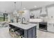 Open concept kitchen with large island and breakfast nook at 16247 Hidden Oak Loop, Bradenton, FL 34211