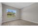 Bedroom featuring wood-look floors and a bright window view at 1800 S San Mateo Dr, North Port, FL 34288
