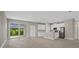 Open concept living space offering a kitchen, living, and dining area with light wood flooring at 1800 S San Mateo Dr, North Port, FL 34288