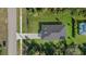 Overhead view of house, driveway and neighboring properties at 1800 S San Mateo Dr, North Port, FL 34288