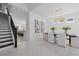 Bright dining room with a large chandelier and modern art at 3512 Hidden Creek Blvd, Sarasota, FL 34240