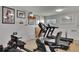 Basement gym with treadmills, rowing machine, and motivational wall art at 3660 Ironwood Cir # 101M, Bradenton, FL 34209
