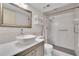 Modern bathroom featuring a large mirror, stylish vessel sink, and a sleek tiled shower at 3660 Ironwood Cir # 101M, Bradenton, FL 34209