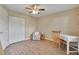 Bright bedroom with a ceiling fan, wood floors, and a large closet at 3660 Ironwood Cir # 101M, Bradenton, FL 34209
