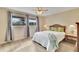 Comfortable bedroom with a large window offering outdoor views and stylish decor at 3660 Ironwood Cir # 101M, Bradenton, FL 34209