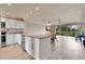 Well-lit kitchen flows into the dining area with stainless steel appliances and granite countertops at 3660 Ironwood Cir # 101M, Bradenton, FL 34209