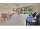 Open-concept living area with large windows offering serene views of the adjacent green space at 3660 Ironwood Cir # 101M, Bradenton, FL 34209