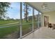 Living room with sliding doors and golf course view at 3660 Ironwood Cir # 101M, Bradenton, FL 34209