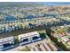 Aerial view of a condo building situated on a canal with many boats at 4452 Garnet Dr # 205, New Port Richey, FL 34652