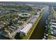 Aerial view of waterfront community featuring multiple buildings and boat docks at 4452 Garnet Dr # 205, New Port Richey, FL 34652