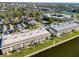 Aerial view of condo building near waterfront with lush greenery at 4452 Garnet Dr # 205, New Port Richey, FL 34652
