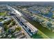 Aerial view of condo building showcasing waterfront access and canal views at 4452 Garnet Dr # 205, New Port Richey, FL 34652