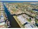 Aerial view of waterfront community featuring canal-front homes and boat docks at 4452 Garnet Dr # 205, New Port Richey, FL 34652