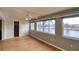 Bright bedroom with water views, laminate wood floor, and a spacious closet at 4452 Garnet Dr # 205, New Port Richey, FL 34652