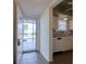 Inviting condo entryway featuring tiled floors, leading to a bright living space and partial kitchen view at 4452 Garnet Dr # 205, New Port Richey, FL 34652