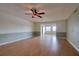 Living room with wood floors and a ceiling fan at 4452 Garnet Dr # 205, New Port Richey, FL 34652