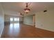 Spacious living room with wood floors and ceiling fan at 4452 Garnet Dr # 205, New Port Richey, FL 34652