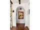 Bright hallway with arched entryway and framed artwork at 4511 Bay Shore Rd, Sarasota, FL 34234