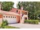 Attached garage with white doors and terracotta driveway at 4511 Bay Shore Rd, Sarasota, FL 34234