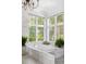 Bathroom with large soaking tub and marble details at 4511 Bay Shore Rd, Sarasota, FL 34234