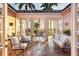 Covered patio with comfortable seating and dining area, overlooking the water at 4511 Bay Shore Rd, Sarasota, FL 34234