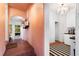 Long entry hallway with terracotta tile floor leading to the kitchen and backyard at 4511 Bay Shore Rd, Sarasota, FL 34234