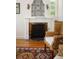 Living room fireplace with decorative tile and mantel at 4511 Bay Shore Rd, Sarasota, FL 34234