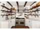 Well-equipped kitchen with stainless steel appliances and open shelving at 4511 Bay Shore Rd, Sarasota, FL 34234