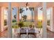Elegant outdoor dining area with sunset views, located on a waterfront property at 4511 Bay Shore Rd, Sarasota, FL 34234