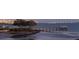 Serene waterfront view with pier and city skyline at 4511 Bay Shore Rd, Sarasota, FL 34234
