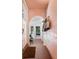 Inviting hallway leading to sunroom with terracotta tile floors at 4511 Bay Shore Rd, Sarasota, FL 34234