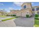 Townhouse exterior with two-car garage and landscaped grounds at 4517 Streamside Ct # 1905, Sarasota, FL 34238