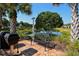 Community grill and patio area with lake view and seating at 4517 Streamside Ct # 1905, Sarasota, FL 34238