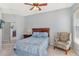 Cozy bedroom with queen bed and a comfortable armchair at 4517 Streamside Ct # 1905, Sarasota, FL 34238