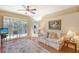 Gathering room with hardwood floors, a sofa, and sliding doors leading to a balcony at 4517 Streamside Ct # 1905, Sarasota, FL 34238