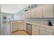 Well-equipped kitchen featuring white cabinetry, stainless steel appliances, and tile floors at 4517 Streamside Ct # 1905, Sarasota, FL 34238