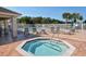 Octagonal hot tub with surrounding lounge chairs and patio at 4517 Streamside Ct # 1905, Sarasota, FL 34238