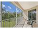 Enjoy the view from this screened balcony with outdoor seating at 4517 Streamside Ct # 1905, Sarasota, FL 34238