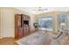 Comfortable Gathering room with hardwood floors, a sofa, and a view of the backyard at 4517 Streamside Ct # 1905, Sarasota, FL 34238