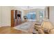 Cozy Gathering room with hardwood floors, a comfy sofa, and access to a balcony at 4517 Streamside Ct # 1905, Sarasota, FL 34238