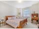 Charming bedroom with sleigh bed, window seat, and built-in desk at 4517 Streamside Ct # 1905, Sarasota, FL 34238