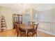 Bright dining room with hardwood floors, a large table, and a chandelier at 4517 Streamside Ct # 1905, Sarasota, FL 34238