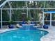 Relaxing pool with a waterfall and decorative features at 4925 Primrose Path, Sarasota, FL 34242