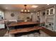 Dining room with a live-edge wood table and built-in shelving at 4925 Primrose Path, Sarasota, FL 34242