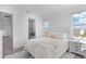 Light and airy bedroom with a comfortable bed and access to a bathroom at 5910 Gulf Of Mexico Dr, Longboat Key, FL 34228