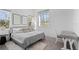Bedroom with a desk and large bed, bright and airy at 5910 Gulf Of Mexico Dr, Longboat Key, FL 34228
